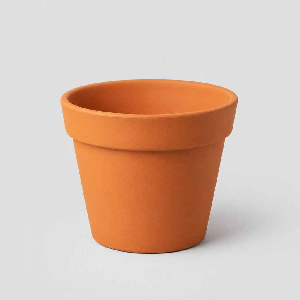 Cache-pot en terre cuite orangée, forme ronde à bourrelet, sur fond gris clair
